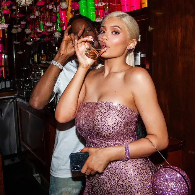 Kylie Jenner & Travis Scott drinking in a Las Vegas bar