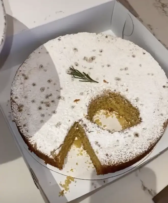 Kylie cut a circular piece from the middle of the cake.