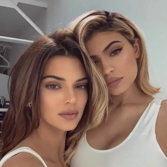 Kylie Jenner (right) and sister Kendall (left) have been accused of not paying their factory workers.