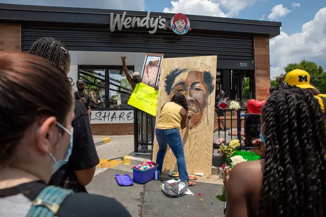 A memorial for Rayshard Brooks outside where he was fatally shot