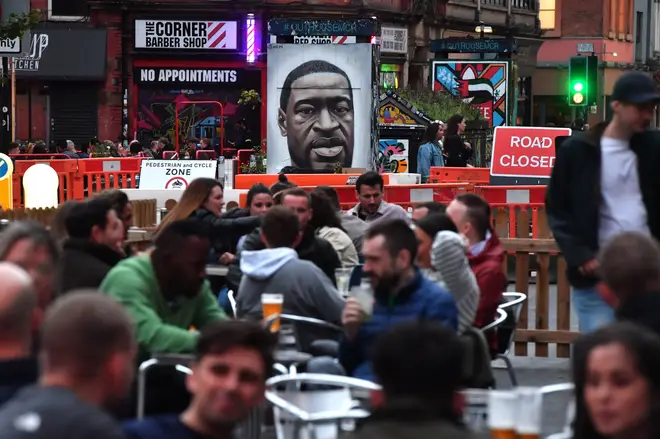 A George Floyd memorial in Manchester has been targeted by racist graffiti