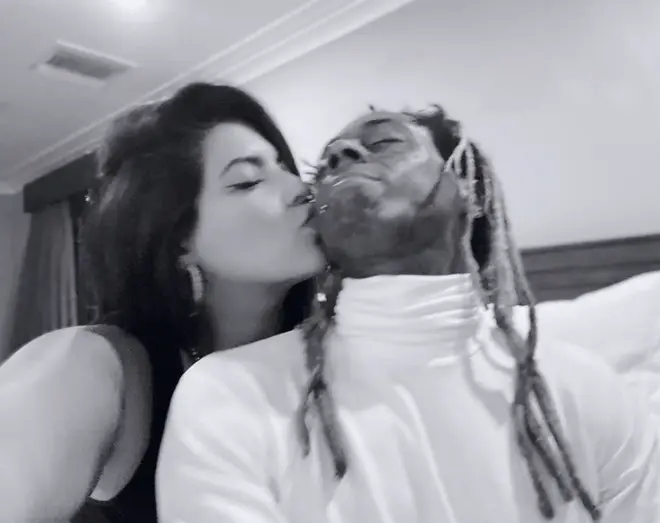Model Denise Bidot posts photo of her kissing Lil Wayne on his cheek