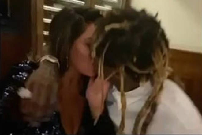 Lil Wayne and Denise Bidot share a kiss on camera