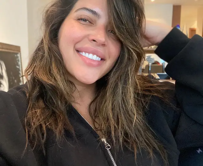 Denise Bidot celebrated her relationship with Lil Wayne on Instagram and clapped back at her haters.
