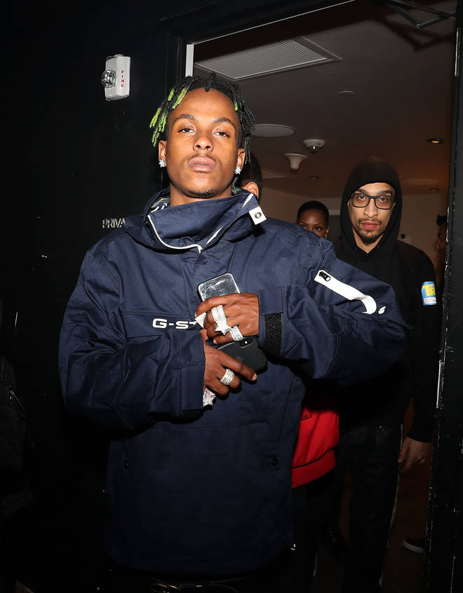 An image of Rich The Kid supposedly speaking with police was shared by Tekashi 6ix9ine.