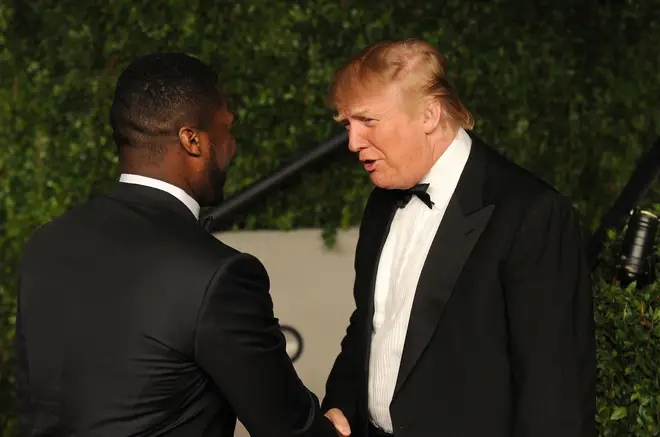 50 Cent and Donald Trump speaking at the 2011 Vanity Fair Oscar Party.