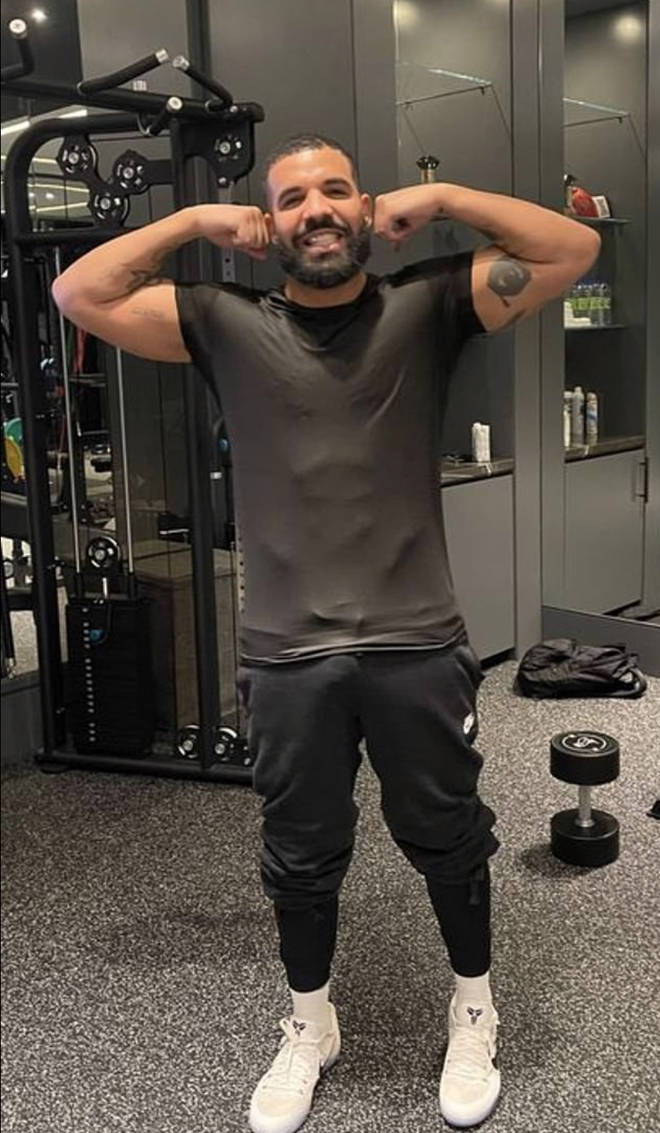 Drake shows off his lean physique post-surgery