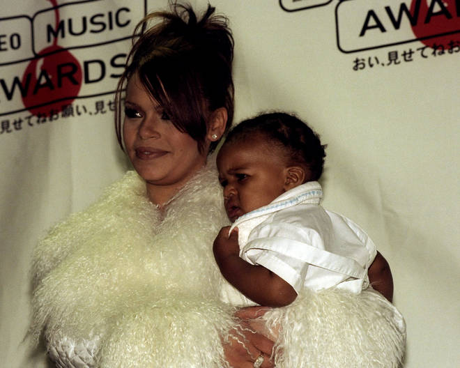 Faith Evans and her son, C. J. Wallace, pictured shortly after the passing of his father Biggie Smalls.