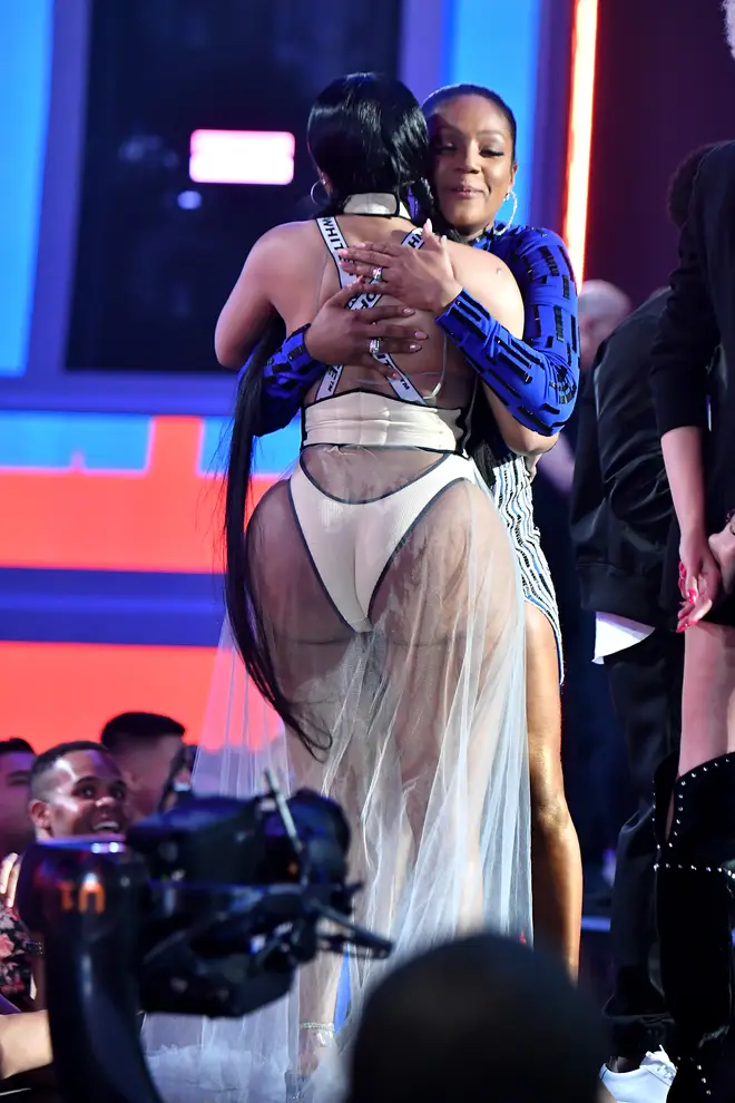 Nicki Minaj hugs Tiffany Haddish at the 2018 MTV VMA's while accepting her award