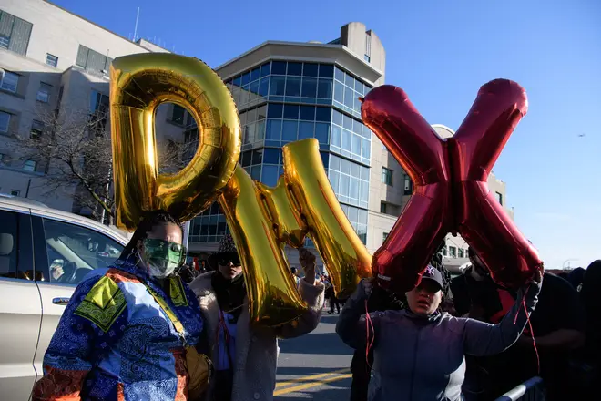 Fans gather to show support for DMX, who was hospitalised and put on life support.