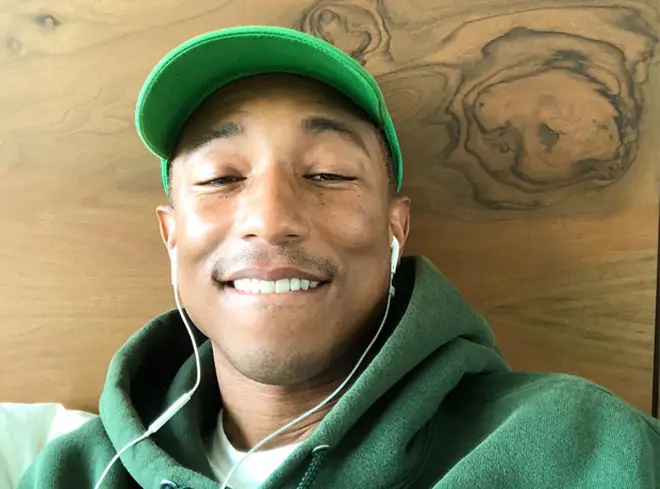 Pharrell Williams Listening To Music On Headphones