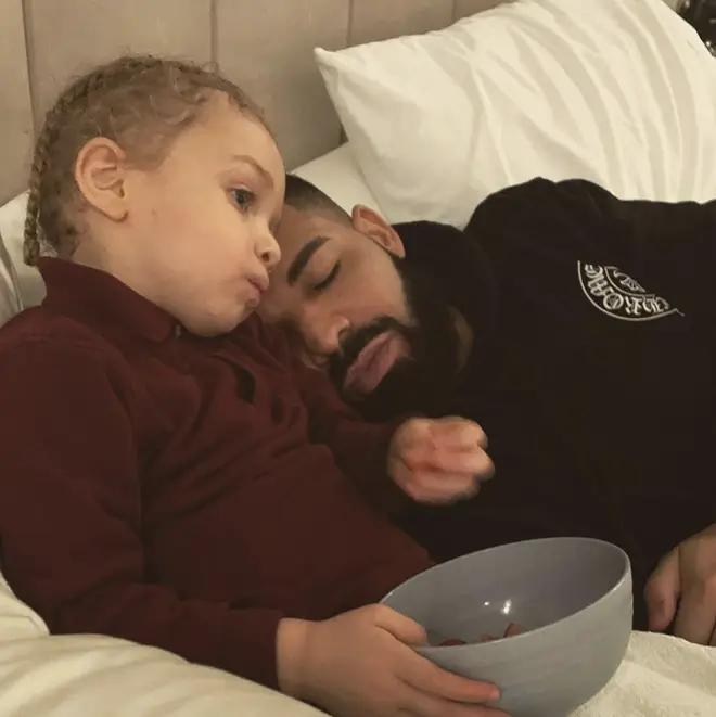 Drake shares a photo of him snuggled up in bed with his son Adonis.