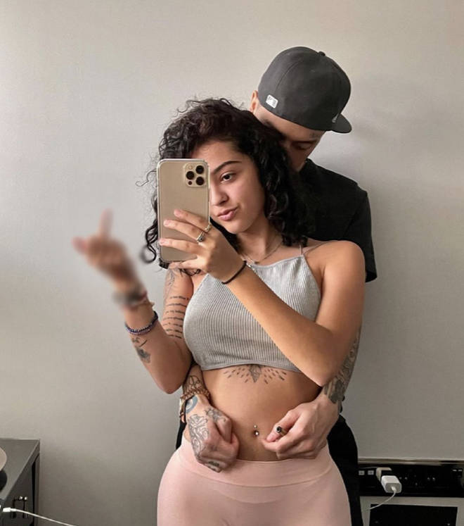 Fans guess who Malu's mystery man is hiding behind her in the first photo she uploaded on Instagram.