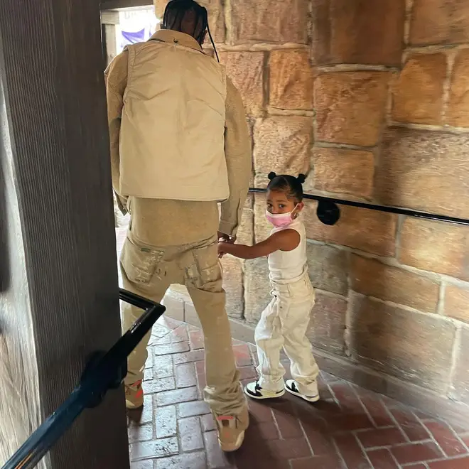 Travis and Stormi wore matching beige outfits.