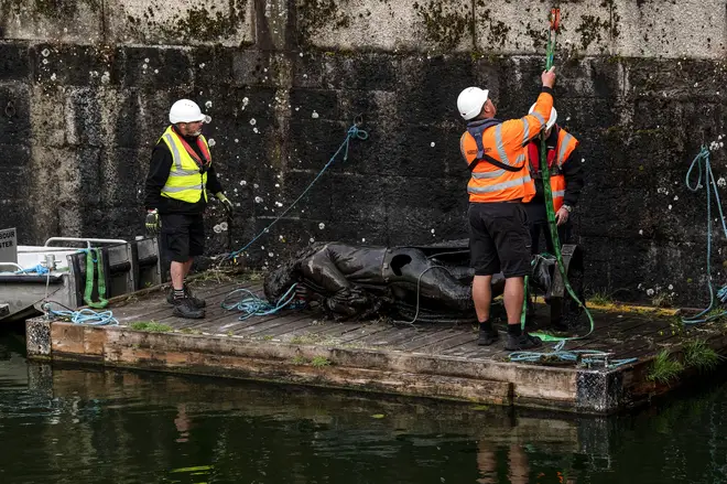 The statue of slave trader Edward Colston is retrieved from Bristol Harbour by a salvage team on June 11, 2020 in Bristol, England.