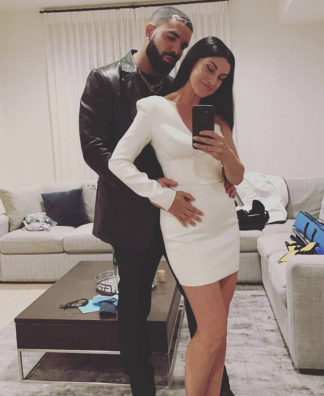 Drake holds a woman's waist in a photo that went viral, leading many to think he is in a new relationship.
