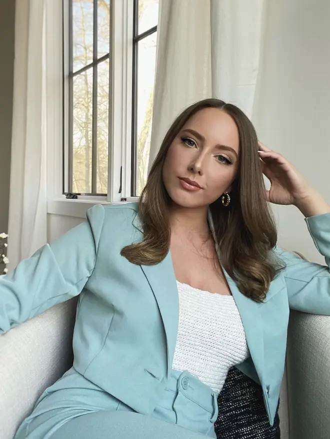 Hailie wears a light blue cropped blazer two piece with matching trousers in stunning photo.