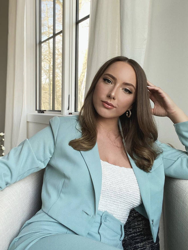 Hailie wears a light blue cropped blazer two piece with matching trousers in stunning photo.