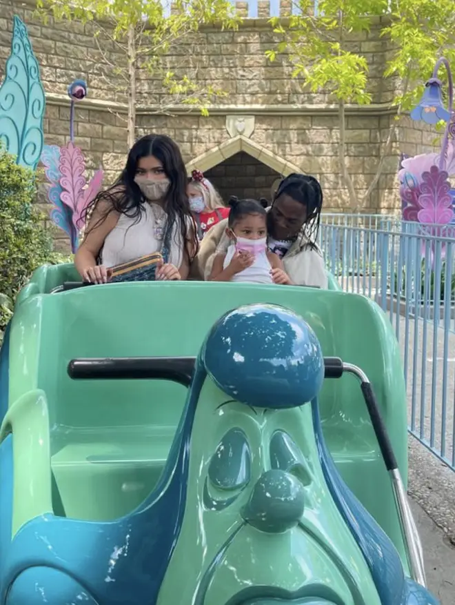 Kylie Jenner shares photo of herself, Travis Scott and their daughter Stormi, on a ride at Disneyland.