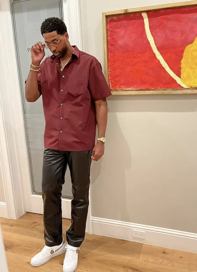 Tristan Thompson rocks a Burgundy shirt while sporting black leather trousers for Chubbs' birthday bash.