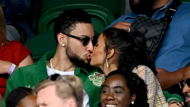 Ben Simmons and Maya Jama share a kiss at the Wimbledon Championships Tennis Tournament at All England Lawn Tennis and Croquet Club on July 05, 2021 in London, England.