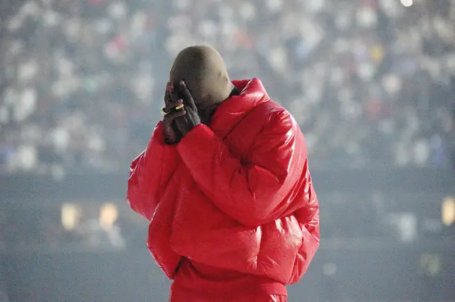 Kanye West sports Yeezy Gap red puffer jacket at his listening event At Mercedes Benz Stadium In Atlanta, GA.