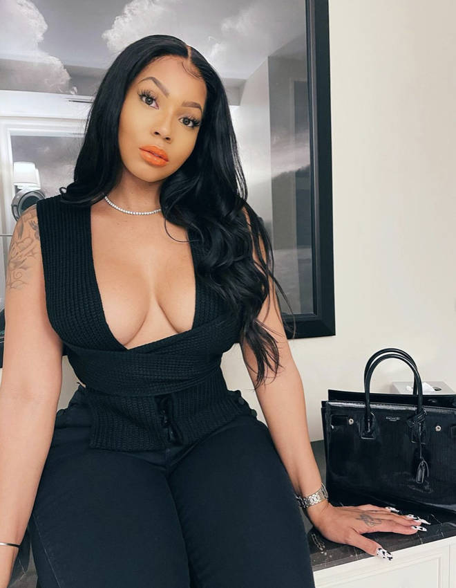 Brittni Mealy poses in all black outfit on Instagram