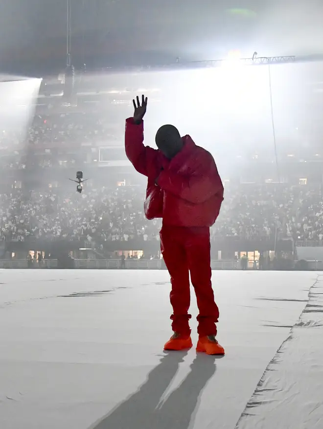 Kanye West sported his Yeezy X Gap red jacket at his previous listening event at Mercedes-Benz stadium.
