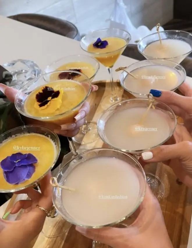 Kylie served up cocktails at her low-key birthday party - spot the green and nude nails.