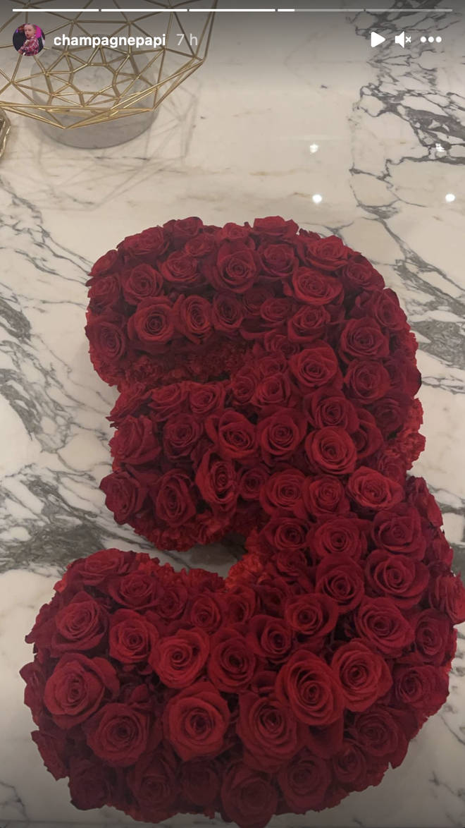 Drake's mother gets him a number '3' flower bouquet.