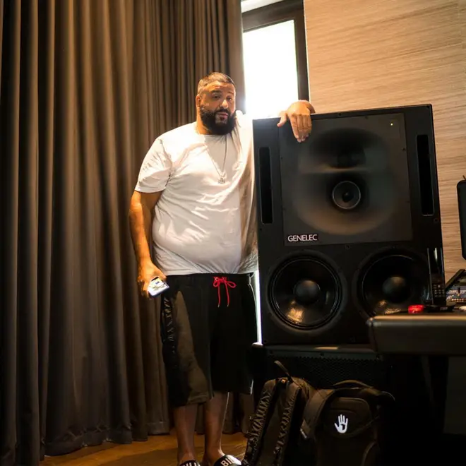 DJ Khaled standing with speakers
