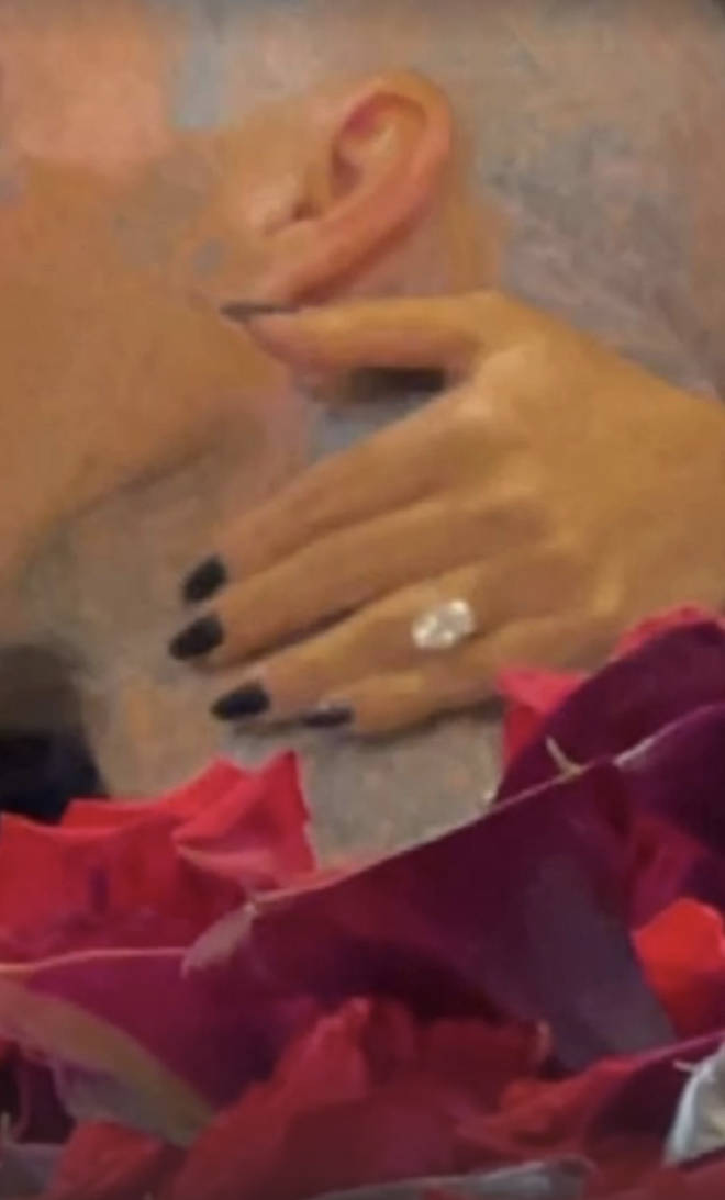 Kylie Jenner gave another view of Kourtney's engagement ring as she held Travis' neck.