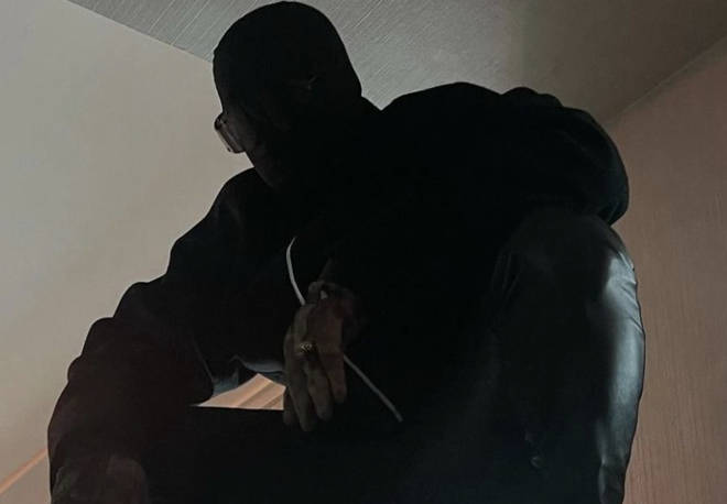 Kanye West dons a black mask as he returns to Instagram.