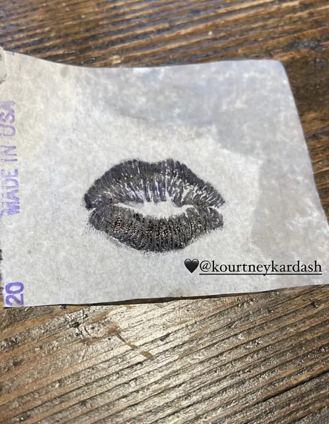 Kourtney Kardashian shares a photo of the imprint of her lips for Travis' tattoo.