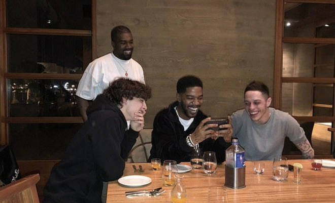 Kim Kardashian shares a snap of the pals hanging out at Kid Cudi's birthday back in 2019.