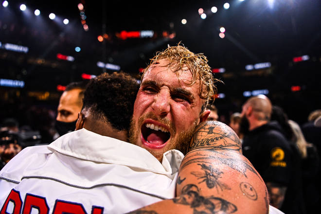 Jake Paul celebrates after knocking out former UFC welterweight champion Tyron Woodley