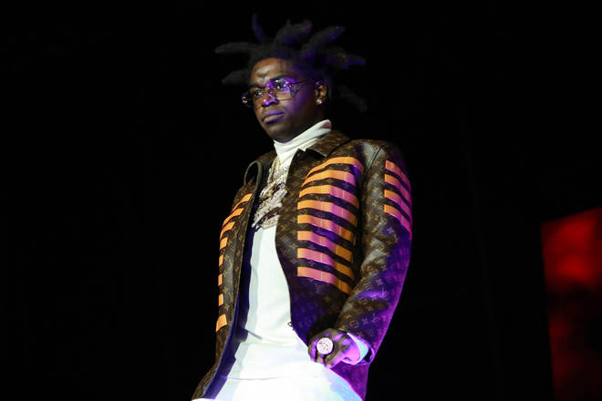Fans slam Kodak Black for allowing a woman to twerk in-front his four-year-old son.