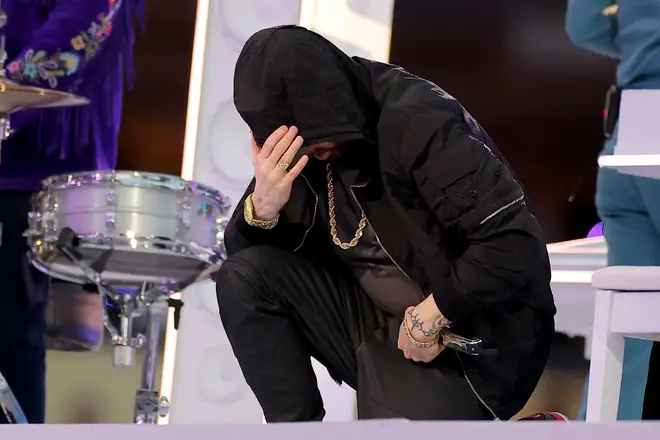 Eminem kneeling during the Pepsi Super Bowl LVI Halftime Show