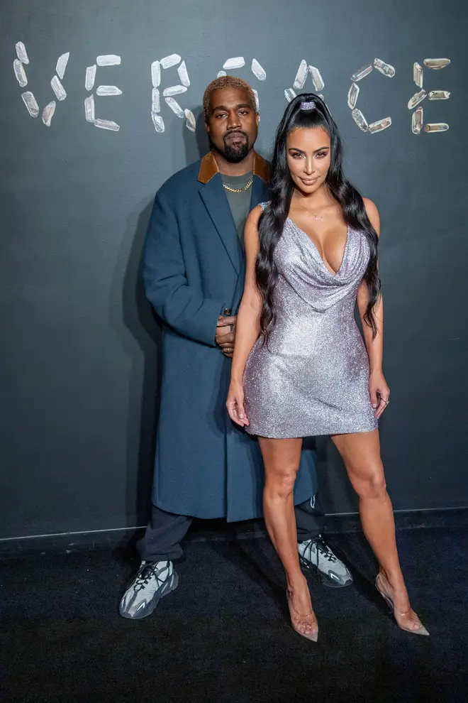 Kanye West and Kim Kardashian West attend the the Versace fall 2019 fashion show at the American Stock Exchange Building in lower Manhattan on December 02, 2018 in New York City