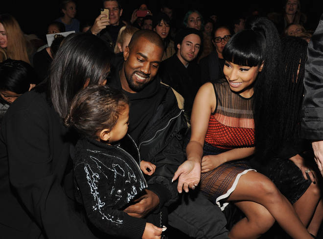 L-R) Kim Kardashian, North West, Kanye West and Nicki Minaj pictured at the Alexander Wang Fashion Show in 2015.