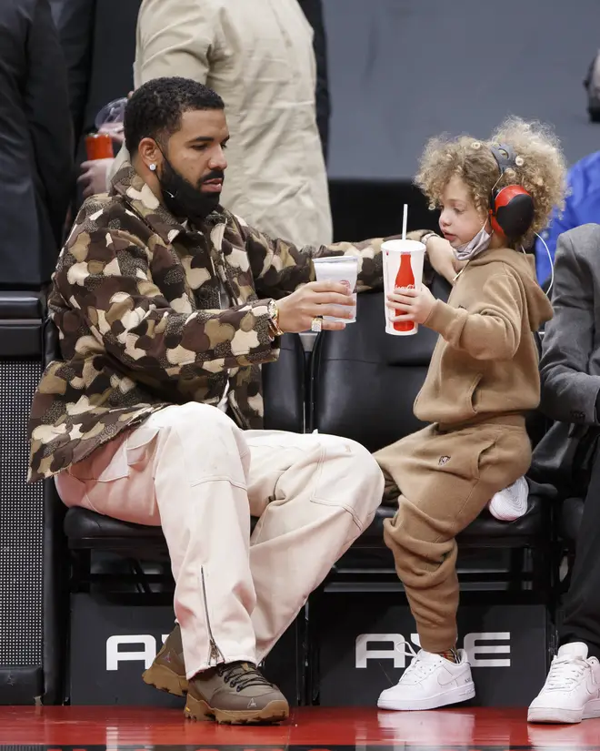 Drake and his son Adonis cheers cups during the NBA game between the Toronto Raptors and the Chicago Bulls.