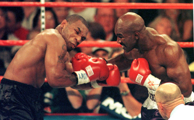 Evander Holyfield won by disqualification after Tyson bit his ears during their fight on June 28, 1997