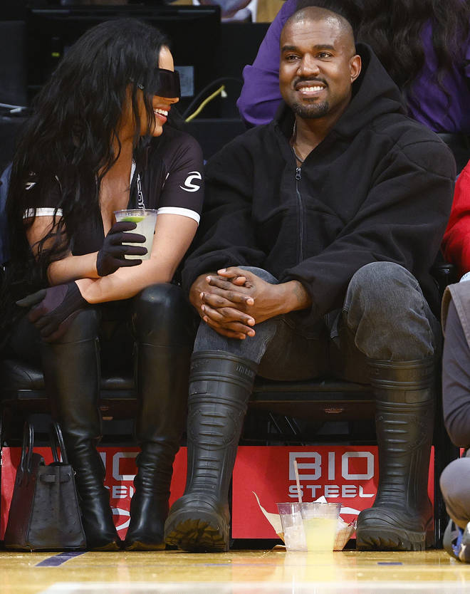 Rapper Kanye West and girlfriend Chaney Jones attend a game between the Washington Wizards and the Los Angeles Lakers in the fourth quarter at Crypto.com Arena on March 11, 2022 in Los Angeles, California