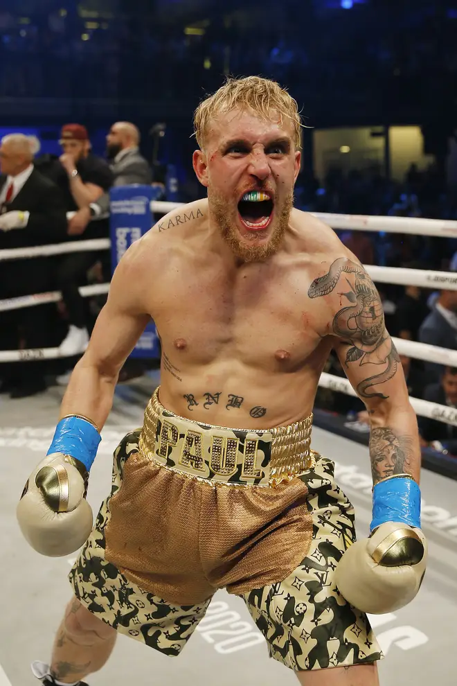 Jake Paul celebrates after defeating AnEsonGib in a first round knockout during their fight at Meridian at Island Gardens on January 30, 2020 in Miami, Florida