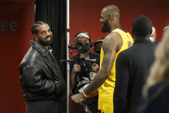 Drake and LeBron James #6 of the Los Angeles Lakers talk after the NBA game between the Toronto Raptors and the Los Angeles Lakers at Scotiabank Arena on March 18, 2022 in Toronto, Canada