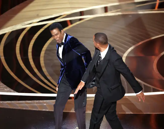Chris Rock (L) got slapped by Will Smith (R) after he made a joke about the actor's wife, Jada Pinkett-Smith.