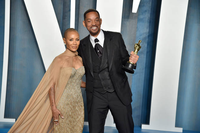 Will Smith (R) and Jada Pinkett-Smith (L) pose together at the 2022 Vanity Fair Oscar Party after Will wins his first ever Oscar.