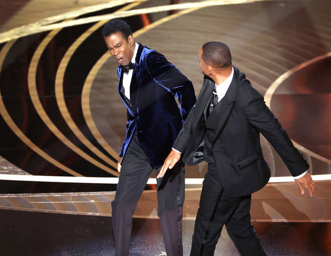 Will Smith (R) hit Chris Rock (L) on stage at the Oscars 2022