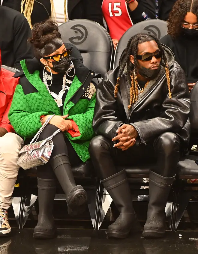 Cardi B and Offset attend the game between the Chicago Bulls and the Atlanta Hawks at State Farm Arena on December 27, 2021 in Atlanta, Georgia