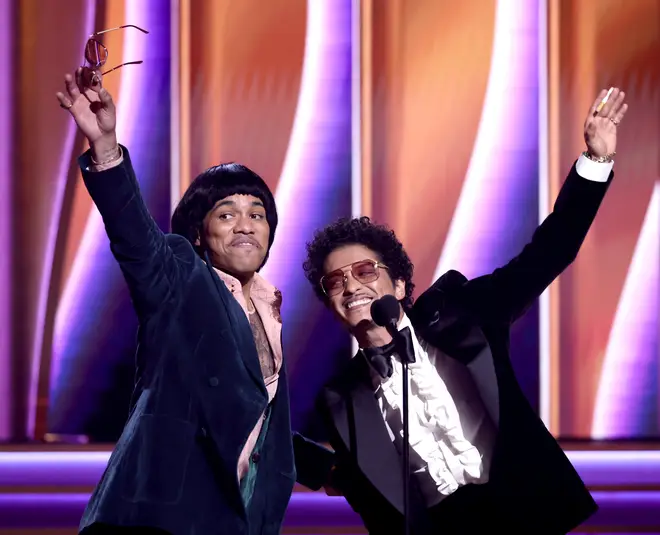 Anderson .Paak and Bruno Mars of Silk Sonic accept the Record Of The Year award for ‘Leave The Door Open’ at the 64th Annual GRAMMY Awards at MGM Grand Garden Arena on April 03, 2022 in Las Vegas, Nevada
